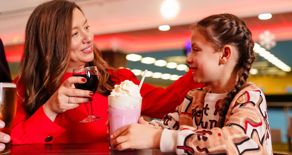 Mum and daughter enjoying drinks
